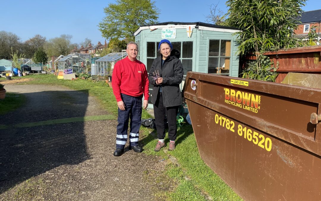Nick Ellis from Brown Recycling and Trish Goodwin from the community garden pose alongside the donated skip